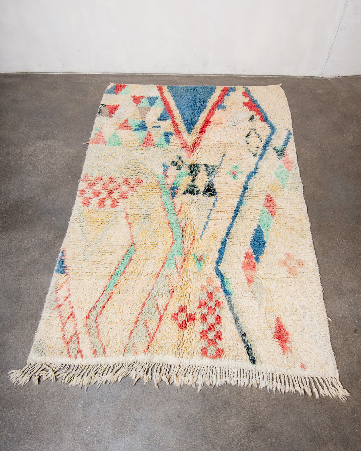 Modern, designer, handcrafted Berber rug from Morocco. Vintage carpet with beautiful colours and patterns and fluffy texture.